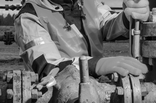 engineer working on an oil and gas pipeline engineer working on an oil and gas pipeline